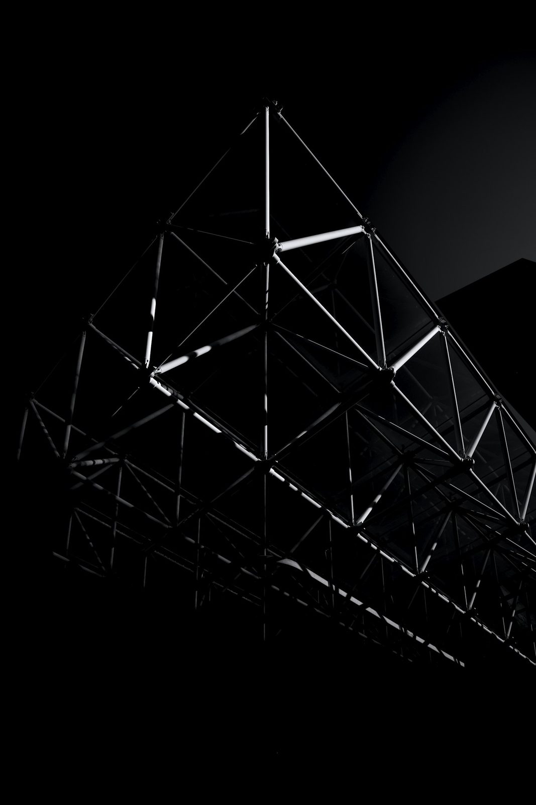 Multi-storey building under construction with crane and exposed structural frame